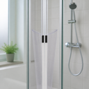 Clear V-seal fitted at glass corner join, marble tile and shower head behind