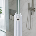White magnetic channel seal fitted to glass shower door edge, marble-effect bathroom