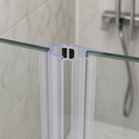 Clear V-seal fitted at glass corner join, chrome shower set and plant nook behind