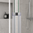 Clear magnetic seals meeting where two glass shower doors close, black magnets visible, marble wall behind