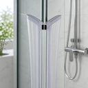 Clear V-shaped seal fitted at glass corner, black magnet caps and alcove bottle behind