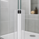 Paired clear seals meeting at angled glass join, magnets visible, shower head behind