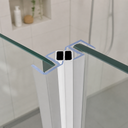 Seal fitted at glass shower corner, green-tinted glass edge and plant behind