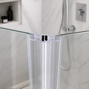 Clear seal fitted at glass shower corner, blue rim visible, tiled wall behind