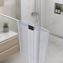 Clear seal fitted at glass shower niche, black magnet block, plant and bottle alcove behind