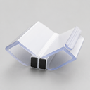 Folded white seal profile with two black magnet blocks, hinge shape on grey background