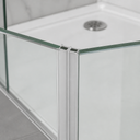Paired frosted seal strips at shower door join, black magnets visible, alcove behind