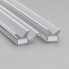 Two clear seal profiles side by side on grey, white magnet strips inset, wave-shaped meeting faces