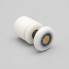 White nylon shower door roller on pale grey, spool body and wheel with a brass hub and blue washer