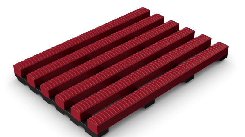 Red High-Traffic Pool and Wet Areas Safety Mat section, featuring wide, raised ribs and open drainage channels for maximum non-slip protection and water flow.