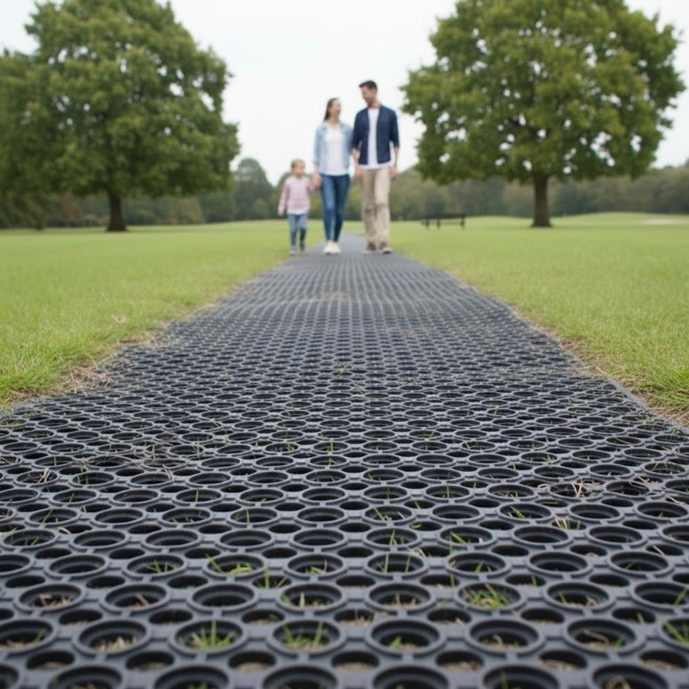 Rubber grass protection mat installed on park walkway providing safe non-slip surface for pedestrians and preventing lawn erosion