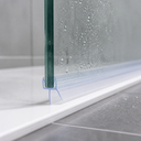 Pre-curved seal fitted to a glass door edge on a white shower tray, water droplets visible