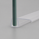 Clear side-fin seal pushed onto the green edge of a glass panel, fin lying flat away from the glass