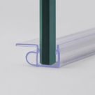 Clear U-channel trim on a glass panel edge, flat wing one side and curled loop the other, low angle