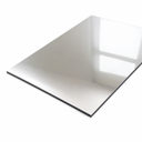 Silver acrylic mirror sheet angled on white, dark backing visible along the cut edge