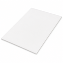 Thin white acetal sheet lying flat at an angle on a white studio background