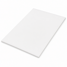 Thin white acetal sheet lying flat at an angle on a white studio background