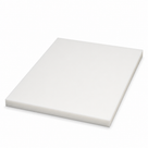 Heavy natural-white acetal slab set at an angle on white, its deep sawn sides clearly in view