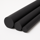 Three thick black rods lying side by side on white, cut ends to the left, receding into the frame