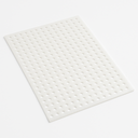 White perforated polypropylene sheet angled on a plain white studio background, round holes in a regular grid