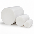 Three white PTFE billets in descending diameter grouped on a plain white background