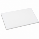 White PTFE slab lying flat and angled on white, matt face with a square-cut edge showing its depth
