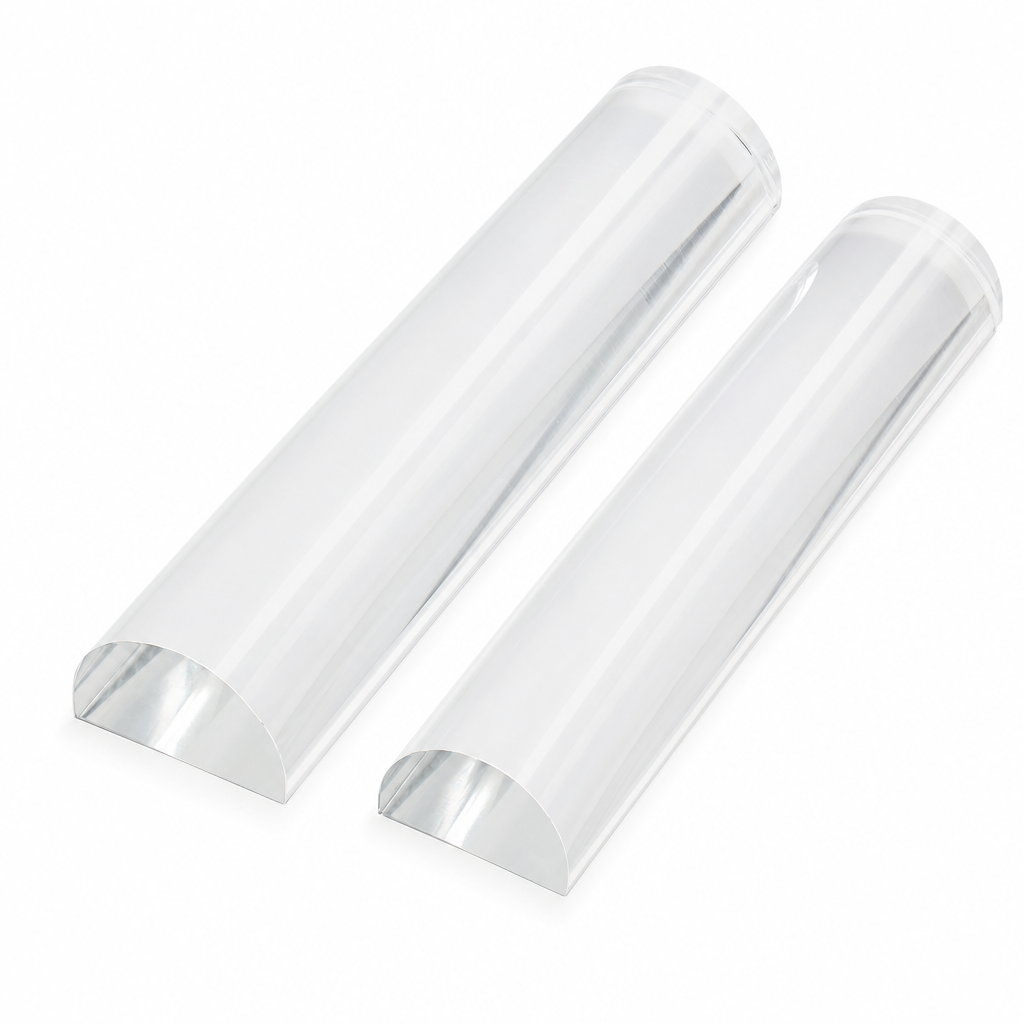 Two clear acrylic half-round rods of different sizes on white, flat faces down