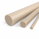 Three tan PEEK rods from thick to pencil-thin, angled on white with cut ends forward