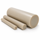 Three beige-tan PEEK rods in stepped diameters grouped on white, angled cut ends forward