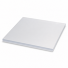 Thick white PETP slab angled on a plain white background, deep square-sawn edge along the near side