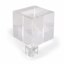 Large clear acrylic cube on white with a much smaller cube in front, glossy polished faces