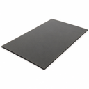 Thick dark grey neoprene sheet lying flat on white, matte surface with the cut edge showing its depth