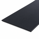Black rubber matting panel angled on white, closely spaced tubular ribs with open ends along the cut edge