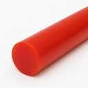 Close-up of an orange-red polyurethane rod on white, matt cut end at the lower left