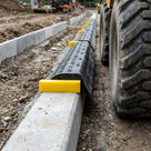 Kerb Guard Spacer for Flat-Top Paving Protection Systems