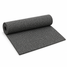 Partly unrolled acoustic rubber crumb underlay on white, showing its black and grey speckled granulate surface.