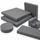 Grey foam pieces grouped on white: square pads, a disc, a bar and a curved saddle-shaped block