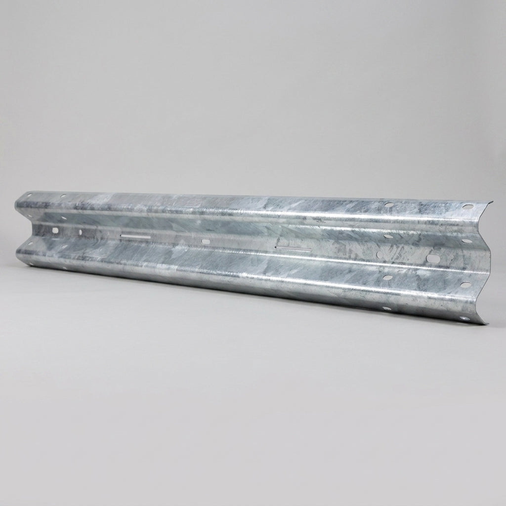 Single corrugated W-profile galvanised steel Armco beam laid on a plain grey background showing its bolt slots