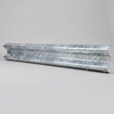 Single corrugated W-profile galvanised steel Armco beam laid on a plain grey background showing its bolt slots