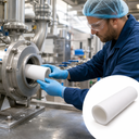 Gloved worker fitting a white PTFE tube into a stainless pump housing, with a studio shot of the tube inset
