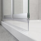Clear multi-fit bifold seal in an aluminium bottom rail, trimmable blade sealing down to the shower tray