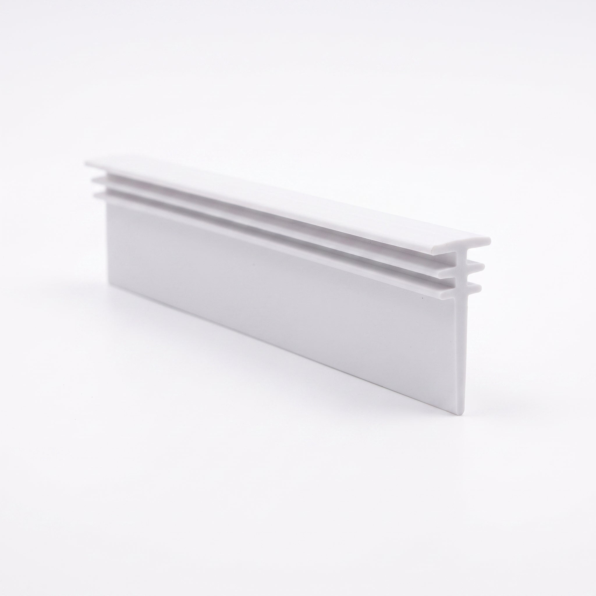 Cut length of BIF013W white multi-fit seal - stacked 10mm, 7mm and 5mm T bars with 26mm trimmable blade