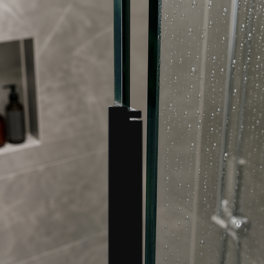Black bifold seal fitted down the vertical edge of a glass shower panel, tiled niche with a bottle behind
