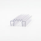 Clear seal offcut on white, two U channels linked by a concertina zigzag membrane, angled studio view