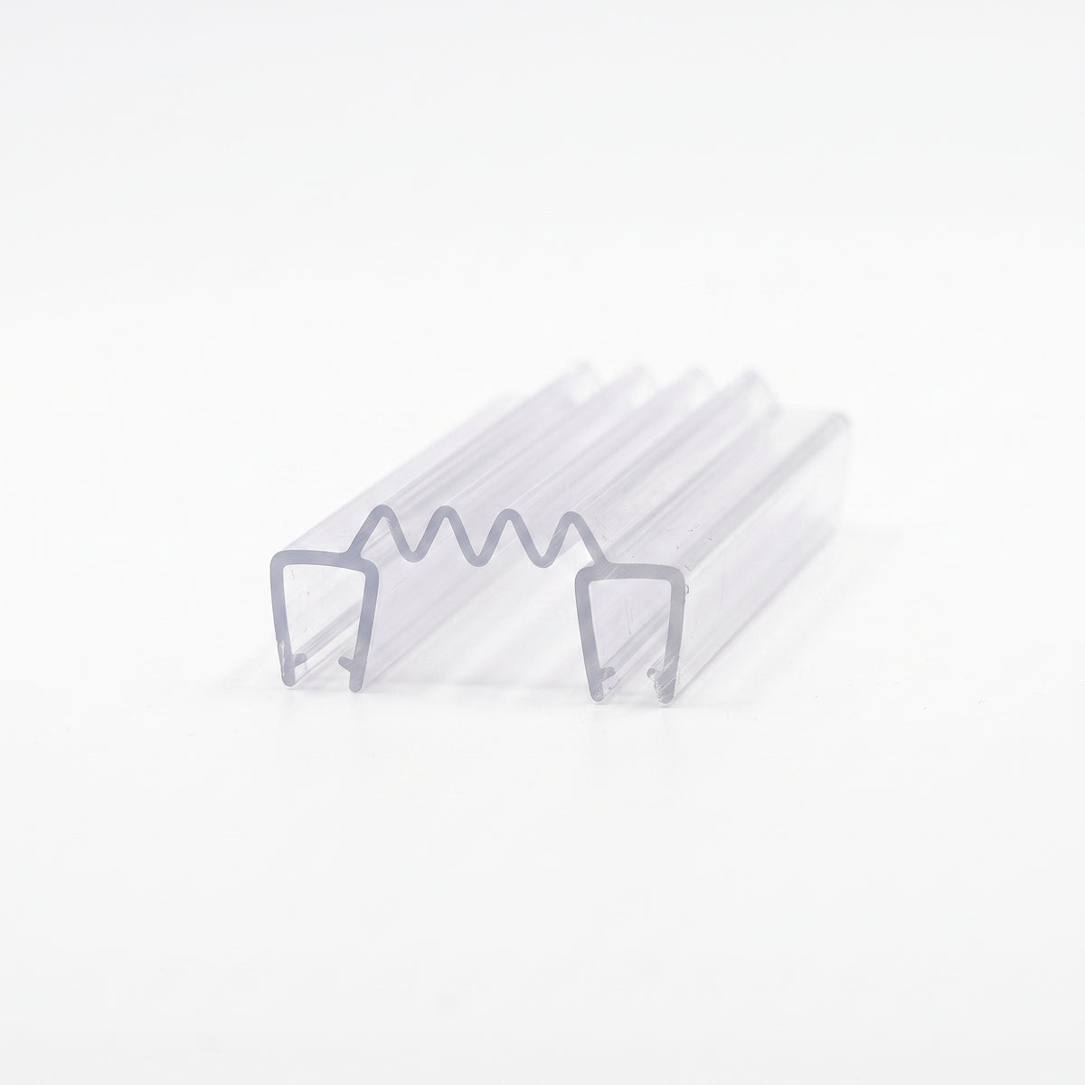 Clear seal offcut on white, two U channels linked by a concertina zigzag membrane, angled studio view