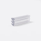 Clear wedge seal offcut angled on white, three stepped barb teeth running down one side