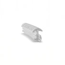 Short offcut of clear cushion seal on white, curved cap over a T-shaped foot, angled studio view