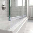 Clear seal with a long thin blade under a folding screen on a white tray, radiator behind