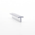 Short clear T-section seal on white, wide flat crown over a short stem, seen at a low angle