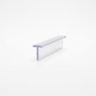 Small clear seal offcut lying on white, T-head at one edge above a flat straight blade